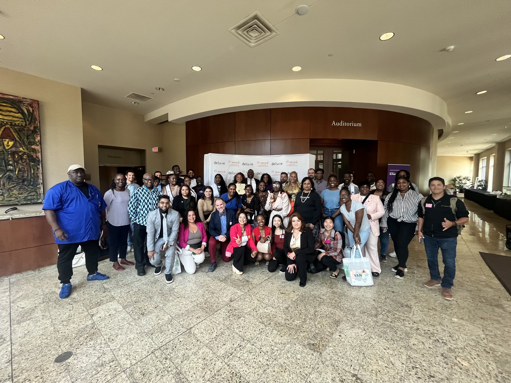 A large group of entrepreneurs and partners gathered in a lobby at BIPOC Entrepreneur Day