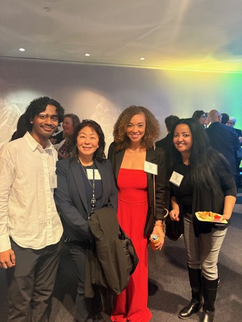 Alivia Boddie with colleagues at an evening networking event