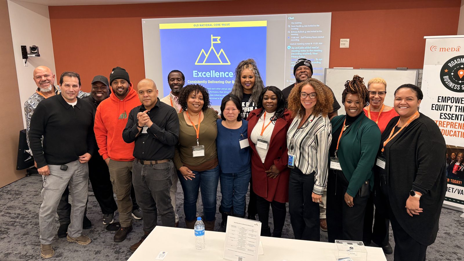 Alivia Boddie with a Roadmap to Business Success cohort in a MEDA meeting room